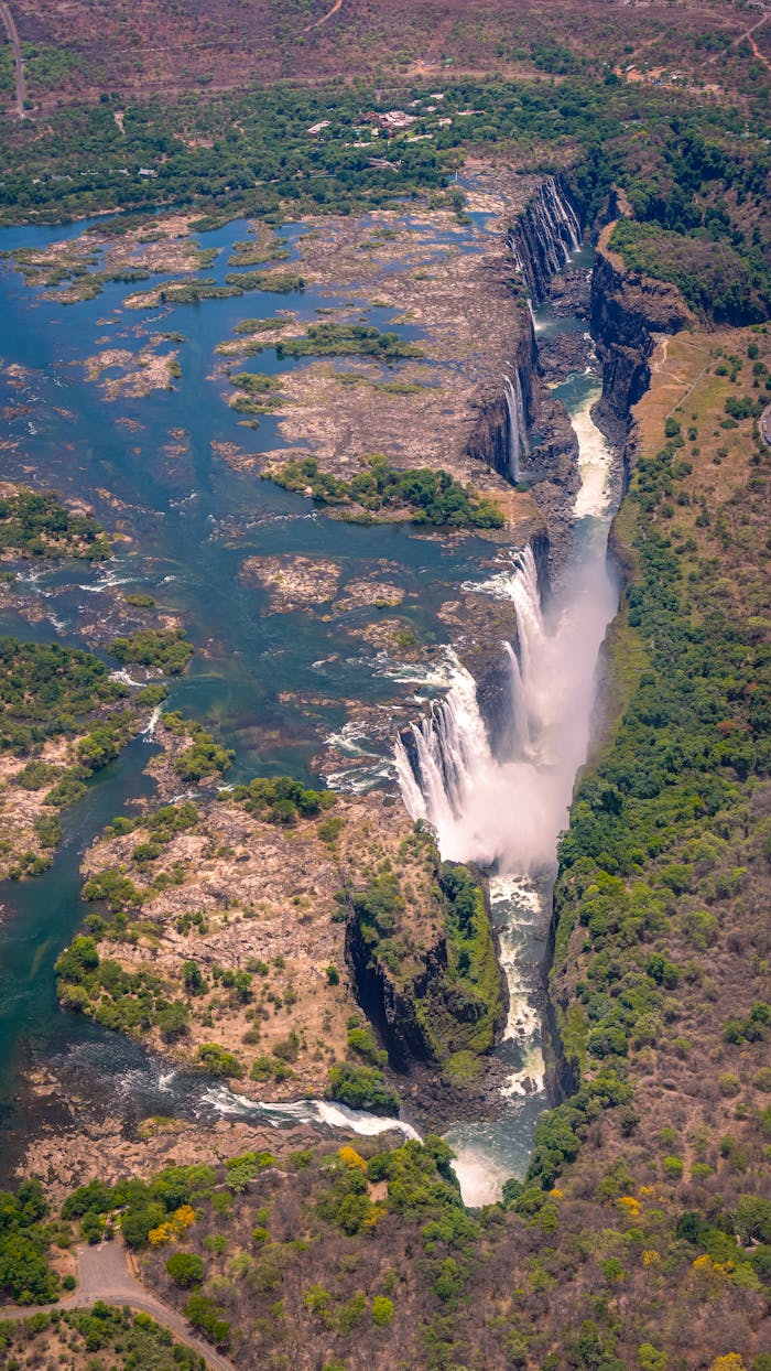 Stunning aerial shot of Victoria Falls, showcasing its breathtaking beauty and surrounding landscape.
